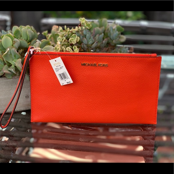 Michael Kors Handbags - NWT Micheal Kors beautiful Brick Red wristlet.